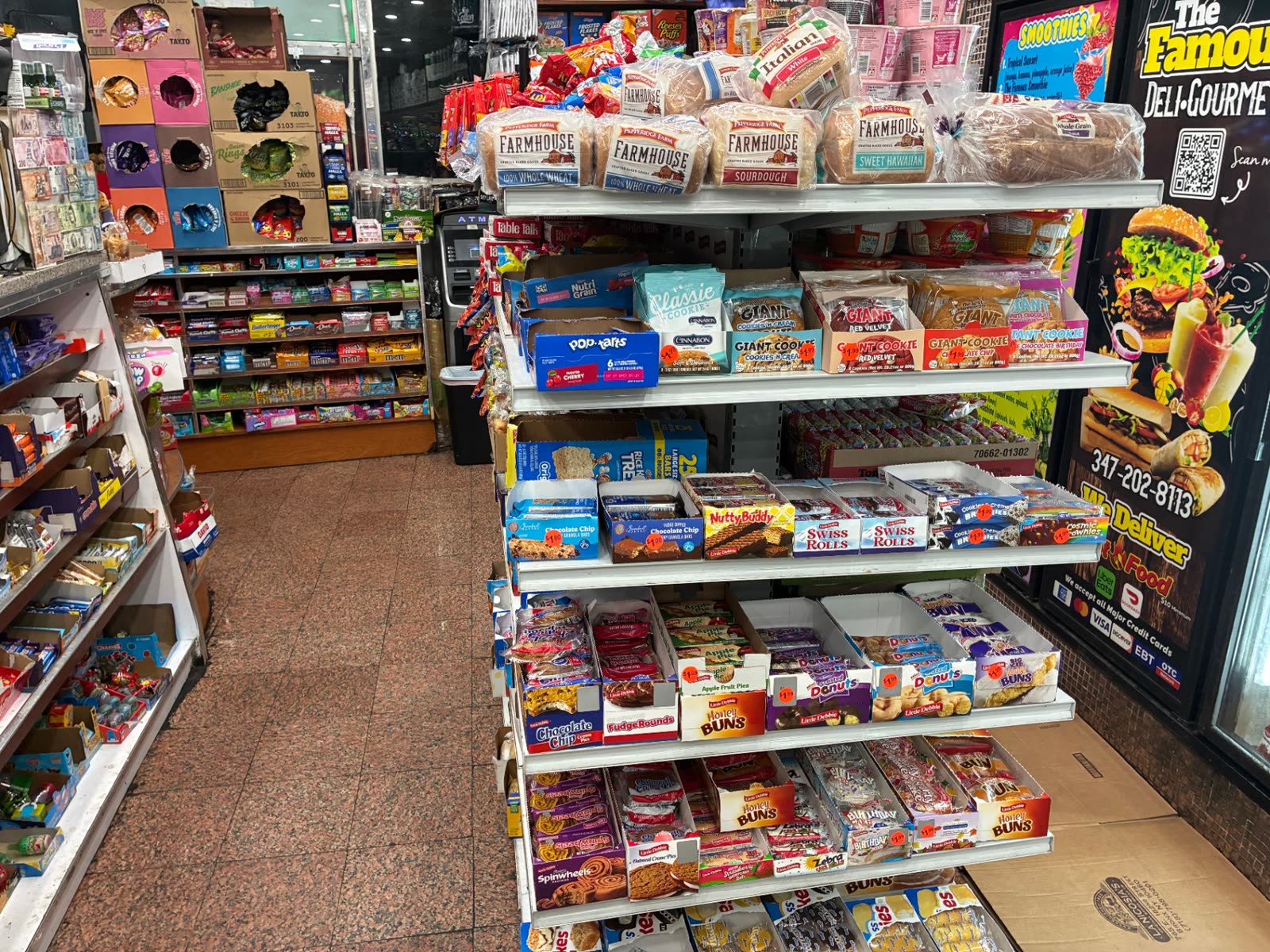 Shelves of bread, cookies and packaged pastries inside The Famous Deli