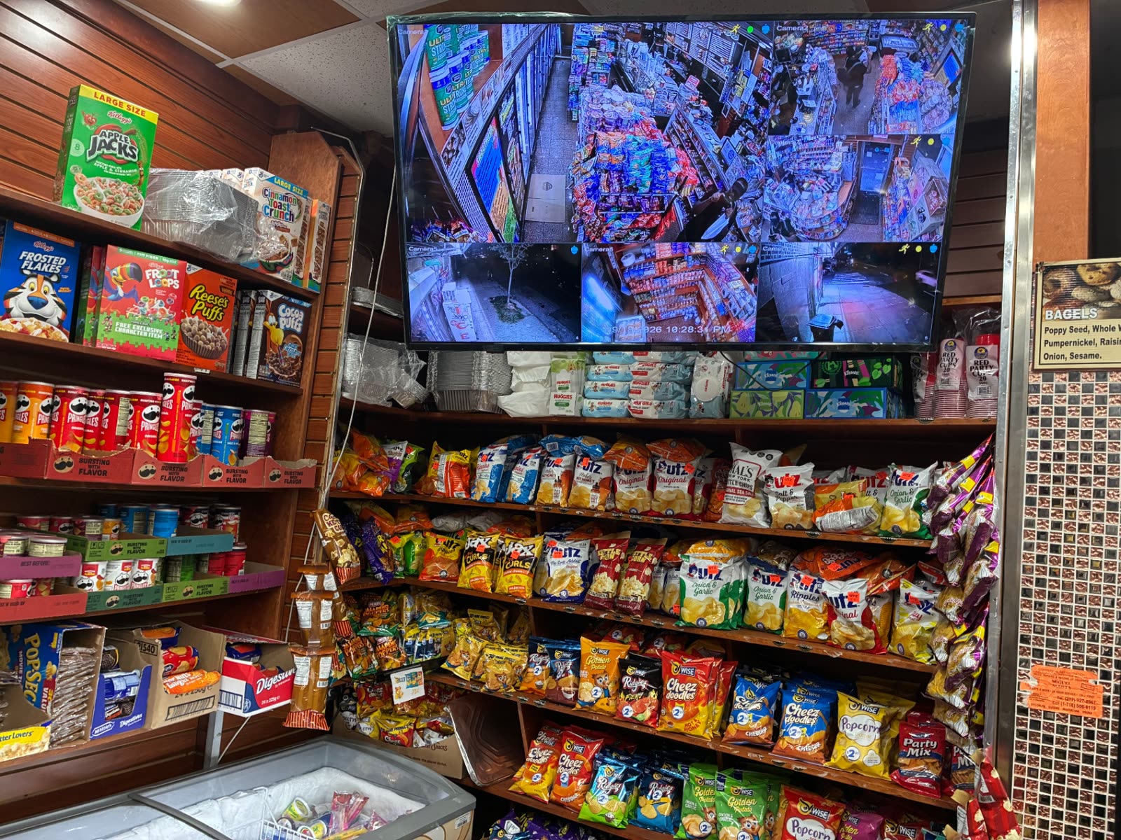 Shelves of potato chips, cereal boxes and snacks inside The Famous Deli