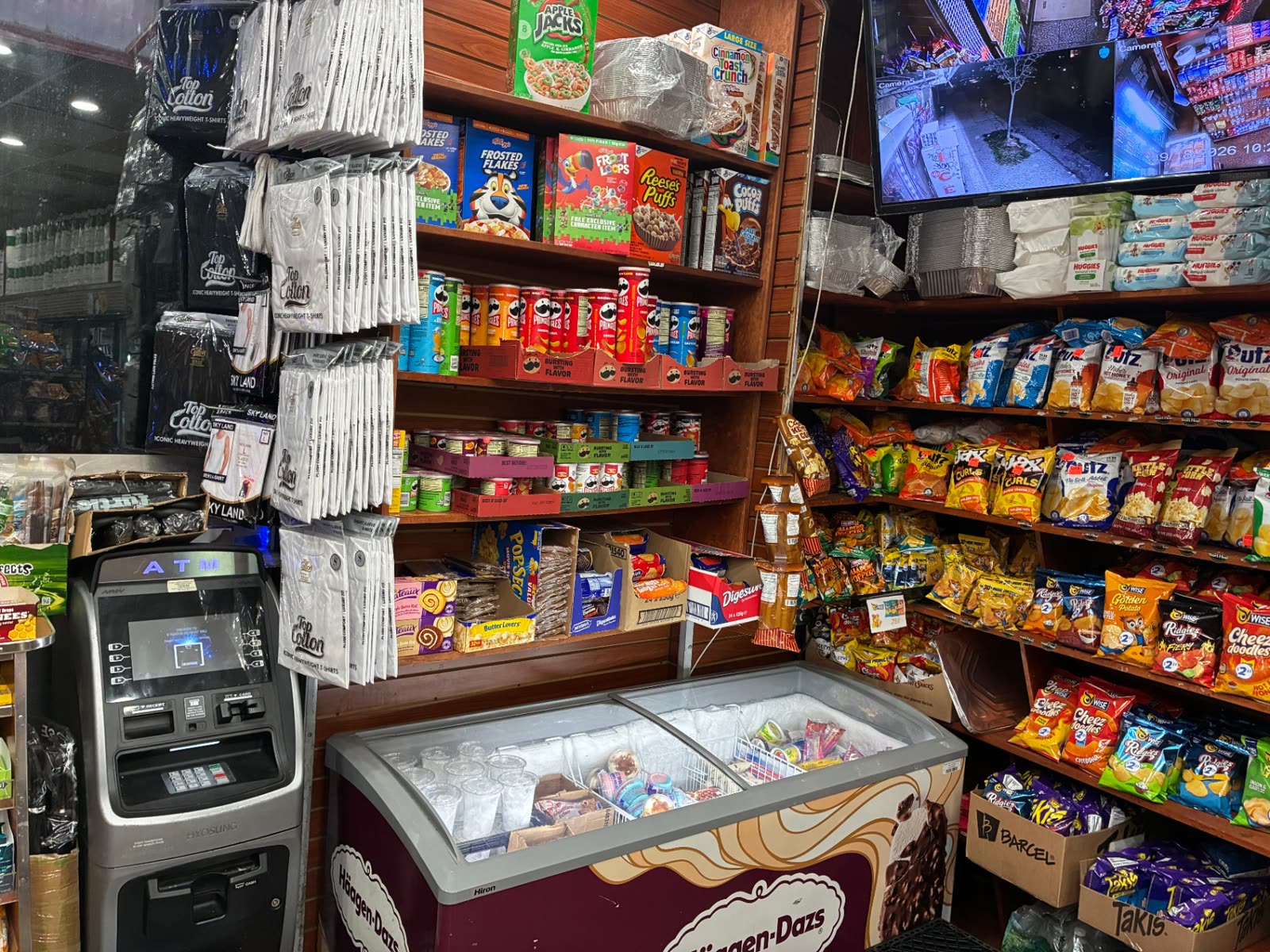 Ice cream freezer and in-store ATM inside The Famous Deli